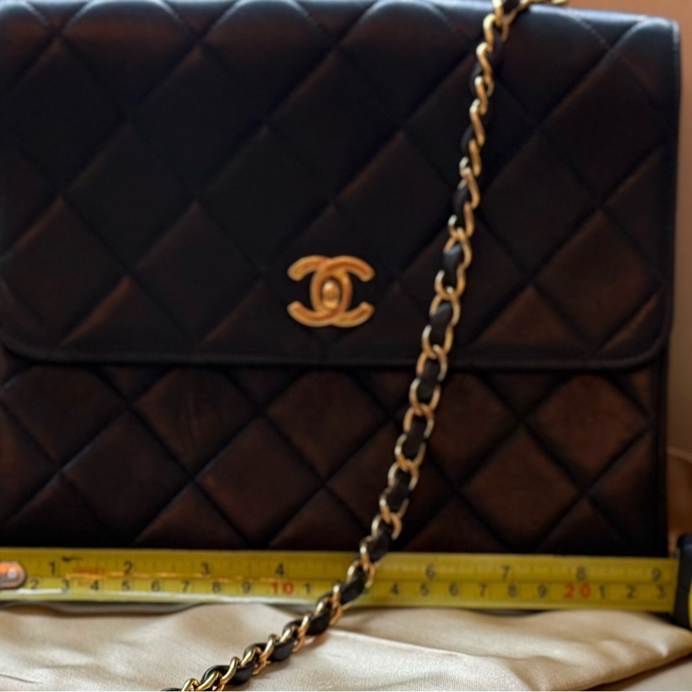 CHANEL Black and Gold Quilted Shoulder Bag with Iconic Chain Strap